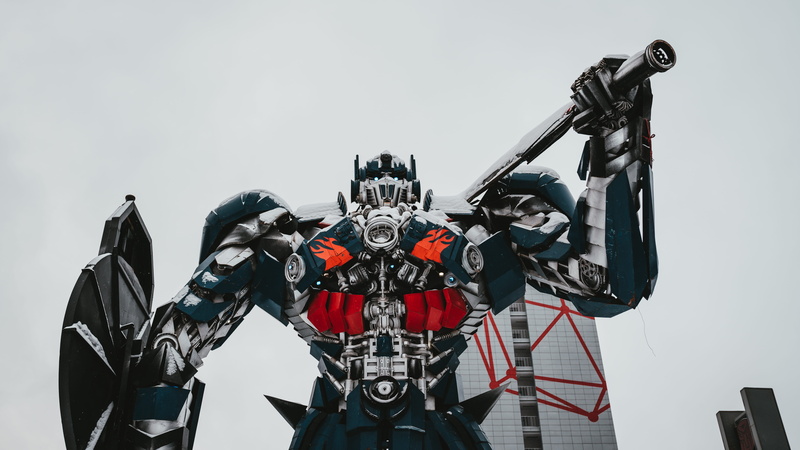 red, studio shot, bicycle, sky, optimus, autobots, outdoors, black color, day, motorcycle, 8K, technology, helmet, no people, transformers, mode of transportation