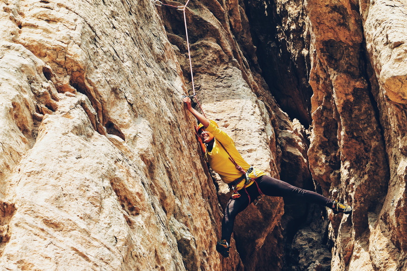 outdoors, sport, people, rocks, protection, rope, lifestyles, skill, rappelling, mountain, real people, cliff, man, safety harness, strength, mountain climbing
