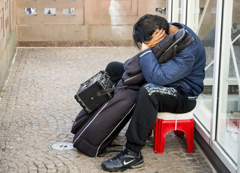 architecture, real people, one person, young adult, day, sleeping, musician, tiredness, tired, leisure activity, looking, contemplation, resting, warm clothing