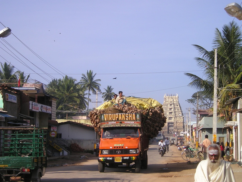 india, cars, mode of transportation, architecture, motor vehicle, road, crowded, truck, orange, vice, two, building exterior, plant, incidental people