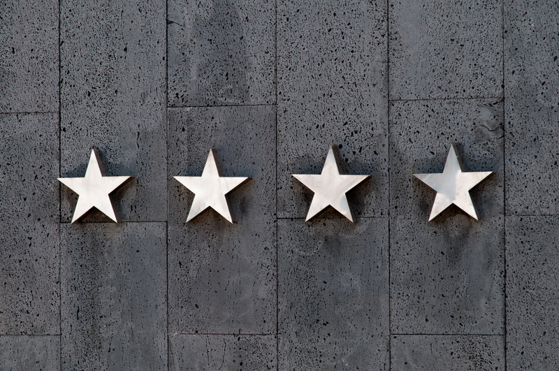 wall - building feature, in a row, communication, people, rating, metal, star, quality, silver, group of objects, shape, hotel, flag, creativity, premium