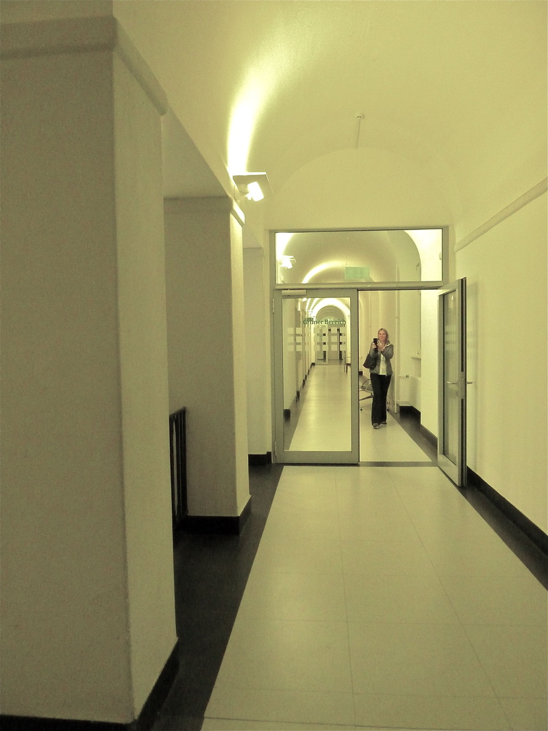 walking, arcade, typical german, corridor, lighting equipment, officials, real people, illuminated, built structure, direction, building, indoors, men