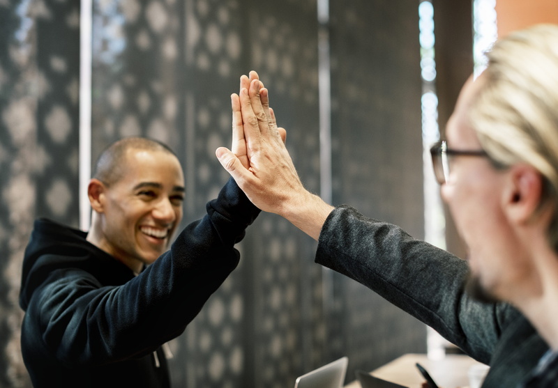smiling, high five, mid adult men, group of people, agreement, business person, communication, group, human limb, limb, team building, deal, friends, hand