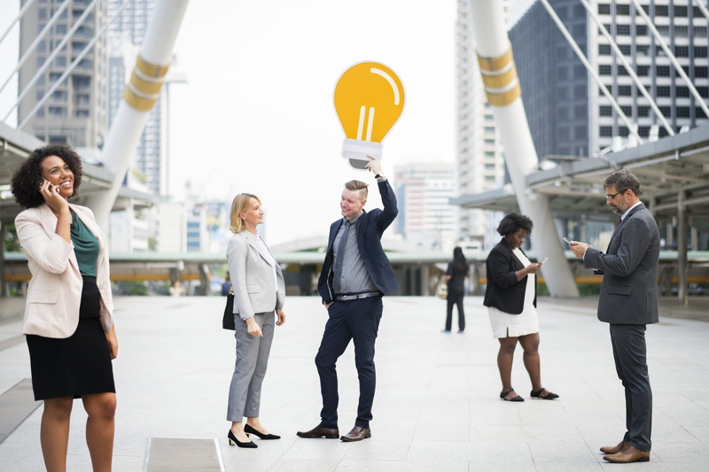office worker, creative, young adult, phone, coworker, travel, group together, skyscraper, group, talking, well-dressed, city, businessmen, successful
