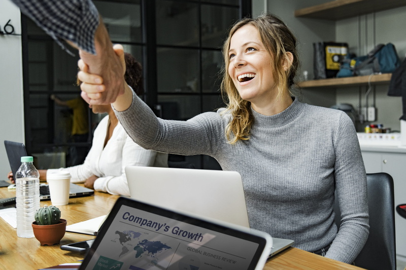 using laptop, cafe, indoors, team building, success, handshake, teamwork, young adult, young women, trust, business, support, working, unity, woman, cooperation