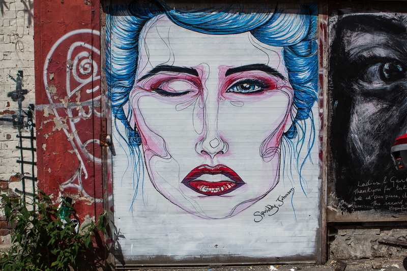 captured, architecture, day, portrait, DSLR, female likeness, east, graffiti, street, photo, human body part, wall, Street art, building exterior, outdoors