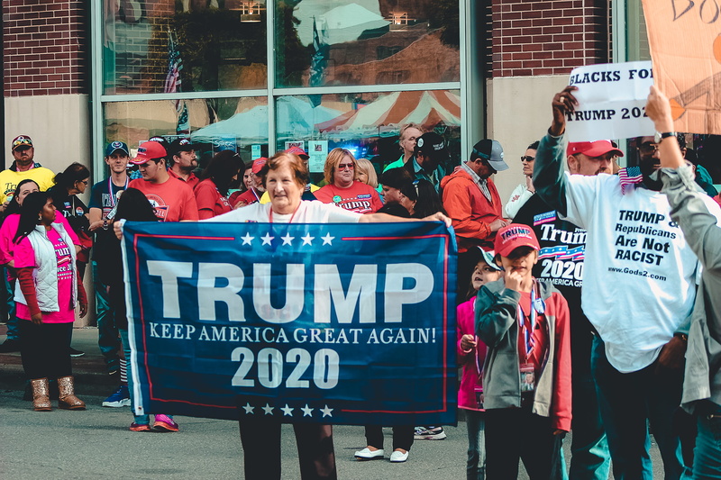 group of people, holding, real people, social issues, road, man, women, street, city, crowd, demonstration, men, protestor, placard, motion, action, adult