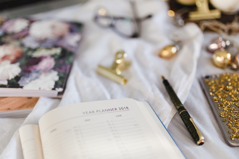 paper, flowering plant, high angle view, still life, study, selective focus, flower, bed, fashion, calendar, starting, book, pearl jewelry, indoors, notebook