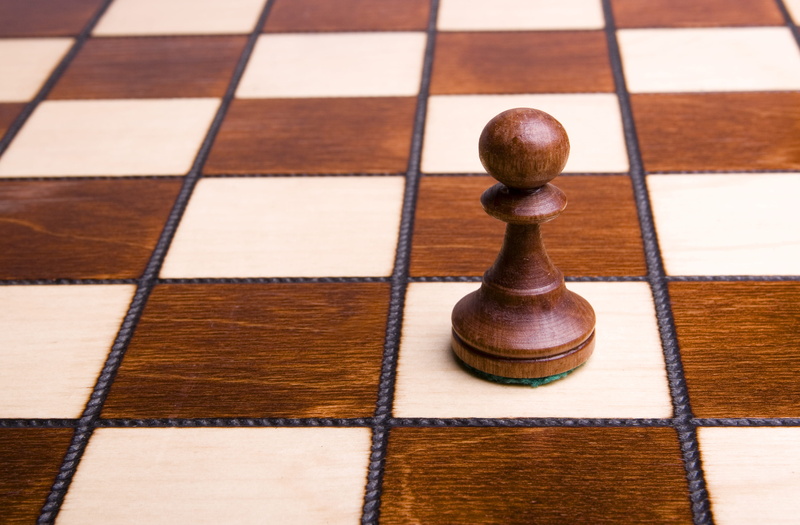 no people, strategy, relaxation, king - chess piece, arts culture and entertainment, close-up, chess, shape, leisure activity, checked pattern, brown, indoors