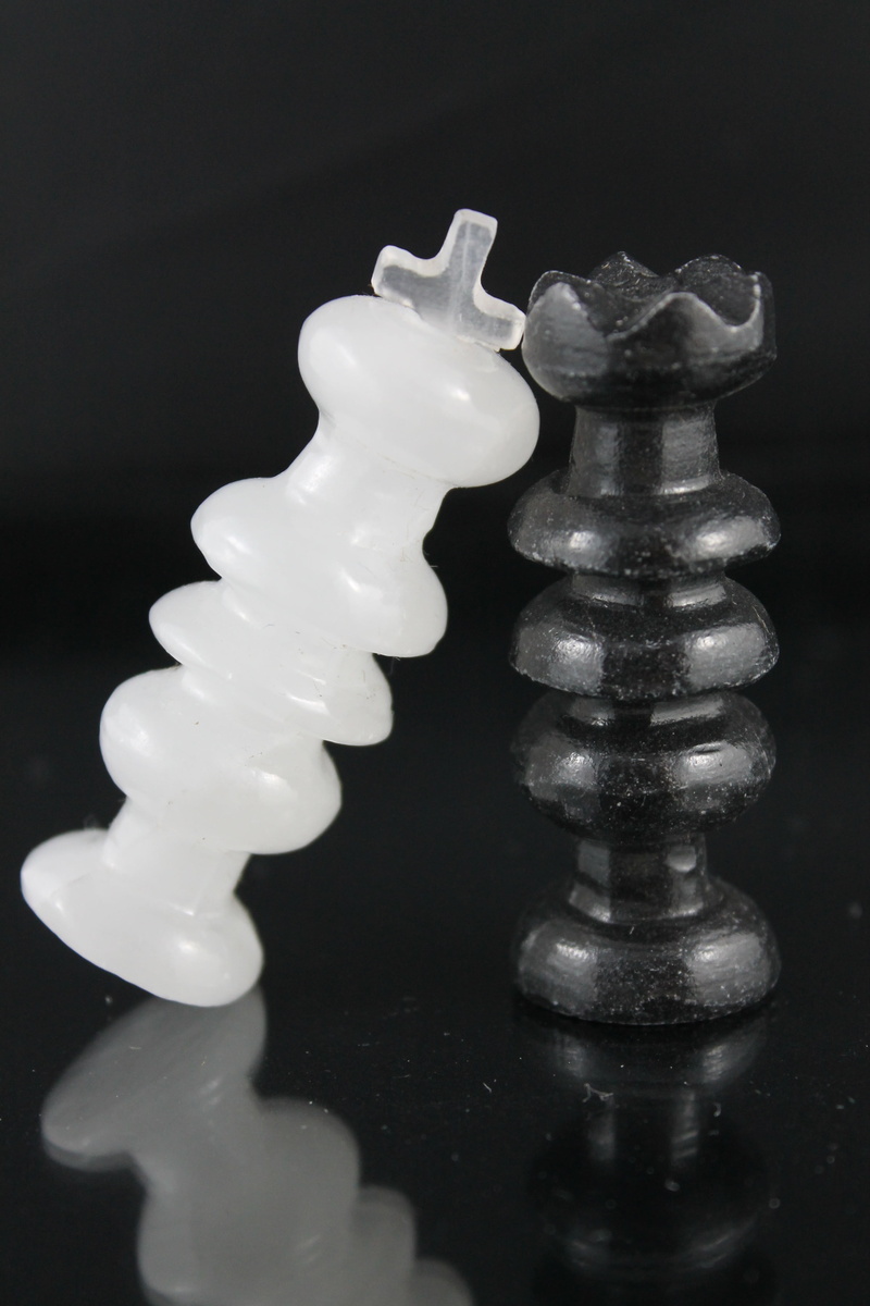 still life, board, arts culture and entertainment, playing pieces, stack, indoors, no people, game, checkmate, white, chess piece, white color, leisure games