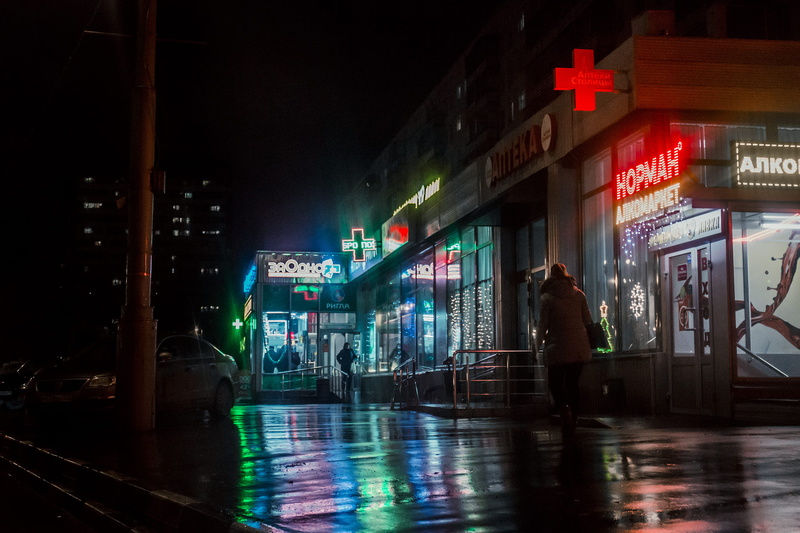 night, western script, store, establishment, neon, illuminated, rain, person, sign, motion, beside, urban, architecture, photo, text, nightlife, autumn