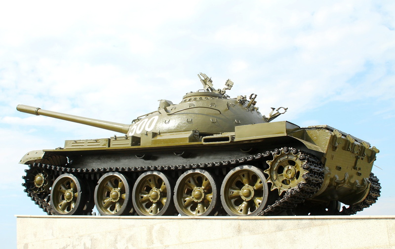 outdoors, battle, mode of transportation, aggression, technique, weapon, armed forces, tank, sky, government, military, war, day, t-55, armored tank, weaponry