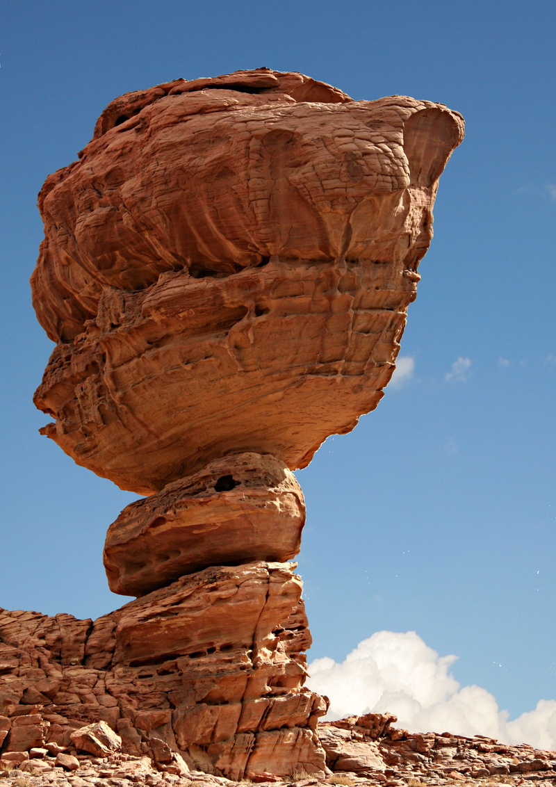 beauty in nature, mushroom rock, sky, tourism, geology, low angle view, no people, nature, day, sandstone, travel destinations, mountain, rock formation