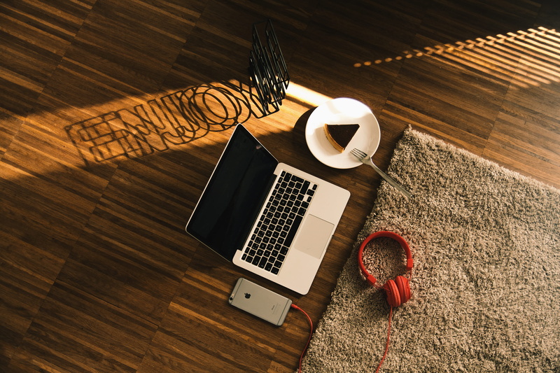 food and drink, wooden floor, wood - material, wooden, laptop, headphone, wooden surface, iphone 6 plus, carpet, headset, saucer, wood, high angle view