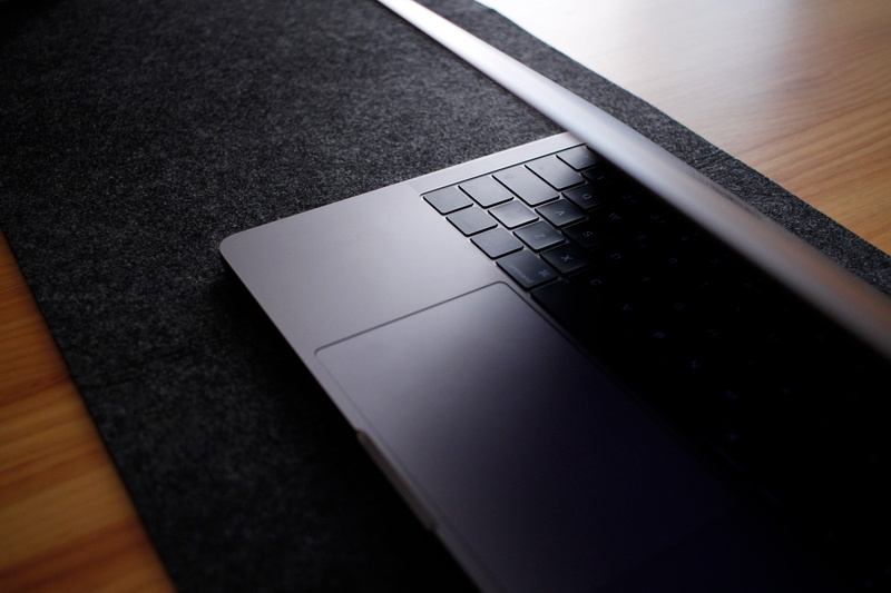 single object, canon, laptop, no people, high angle view, computer, technology, paper, black color, tech, close-up, keyboard, communication, table, day