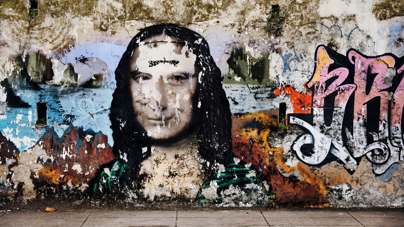 creativity, beautiful woman, text, wall - building feature, one person, art and craft, lifestyles, human face, mural, building exterior, wall, calligraphy