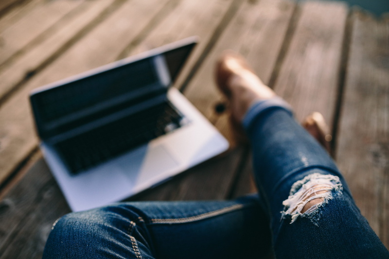 human hand, pier, Macbook, lifestyles, indoors, sitting, wooden boards, Man, outdoors, mobile, human foot, work, jeans, computer, adult, casual clothing