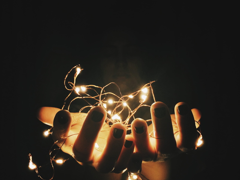 black background, hands, long exposure, santos, burning, motion, one person, studio shot, illuminated, hand, human finger, heat - temperature, sparks, body part