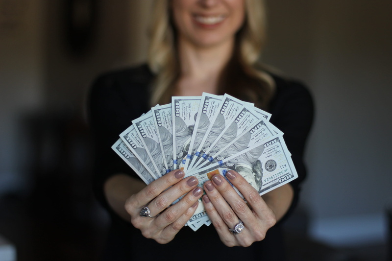 front view, holding, currency, human body part, beautiful woman, one person, hand, money, finance, law of attraction, wealth, adult, paper currency, earning power