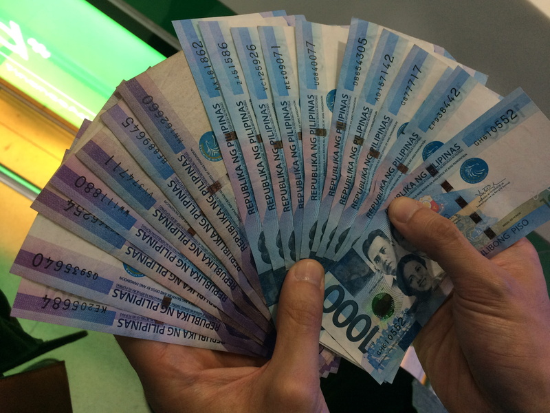 money philippines, economy, leisure activity, paying, hand, peso, person, currency, wealth, human body part, rich, real people, one person, philippine