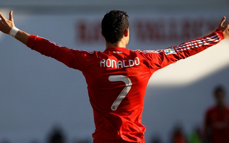 rear view, one person, three quarter length, day, focus on foreground, christiano, human arm, limb, red, Soccer, sport, Cristiano Ronaldo, standing, arms raised