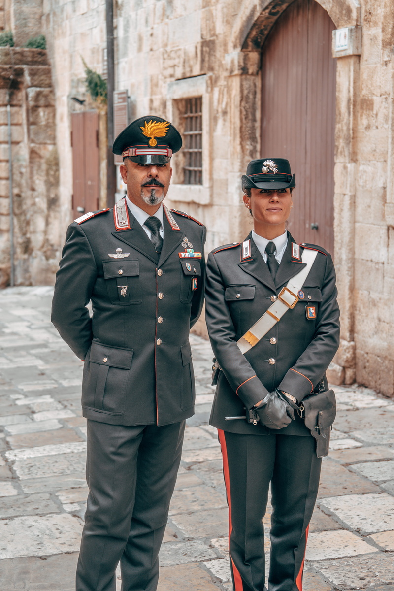 young adult, italian, day, architecture, three quarter length, young men, outdoors, armored, safety, looking at camera, accessories, portrait, military