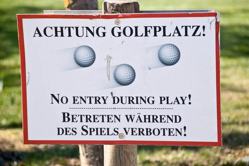 note, focus on foreground, warning sign, direction, golf balls, Sign, road sign, Attention, shield, capital letter, day, spiels, communication, plant, entry
