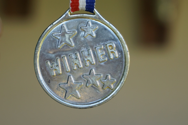 shape, geometric shape, communication, silver colored, indoors, close-up, success, front runner, western script, creativity, award, first, victory, metal