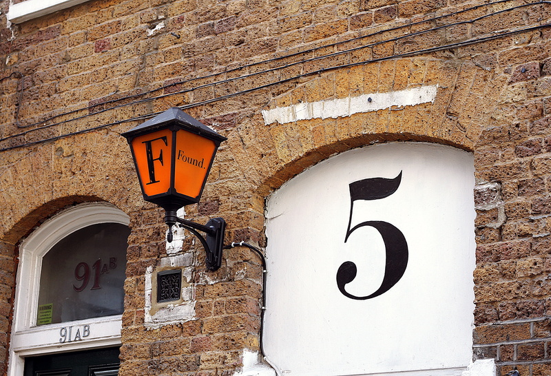 architecture, orange, structure, number, building, city, lighting equipment, brown, day, no people, mount, nature, lamp, outdoors, black, close-up, low angle view