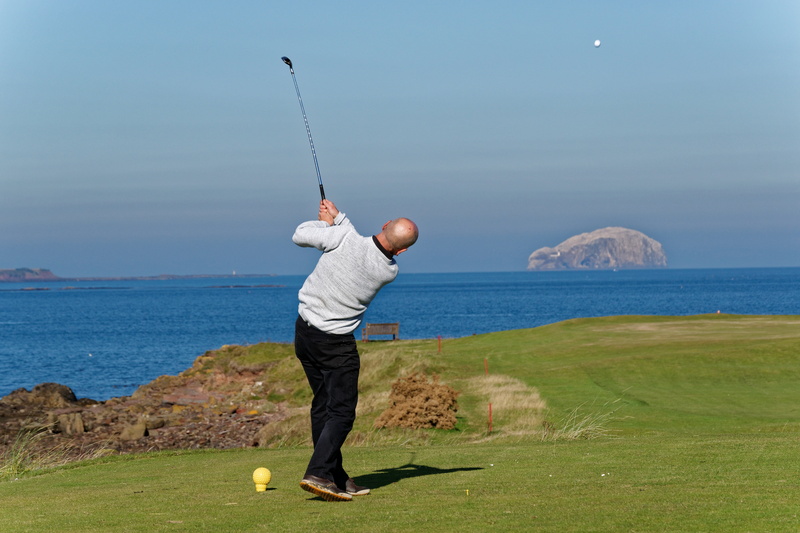 club, activity, leisure, leisure activity, scenery, fun, golfing, tee shot, swing, person, standing, driver, casual clothing, scenic, grass, course, golf