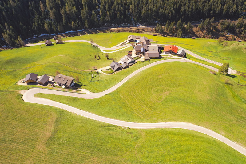 grassland, mound, outdoors, human, person, land, green color, high angle view, italy, lawn, grass, marebbe, day, golf course, slope, road, nature, house