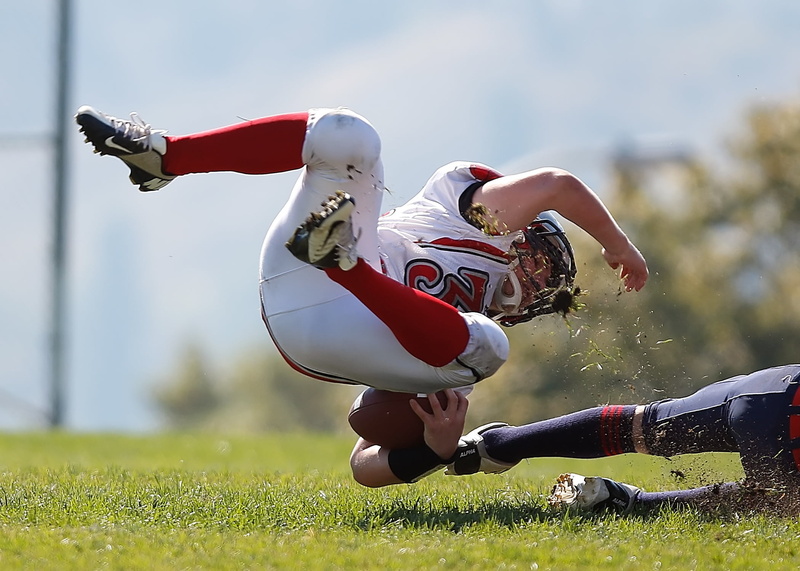 american football - sport, running back, human limb, teenager, adult, sports helmet, sport, grass, horizontal, fall, child, competitive sport, american