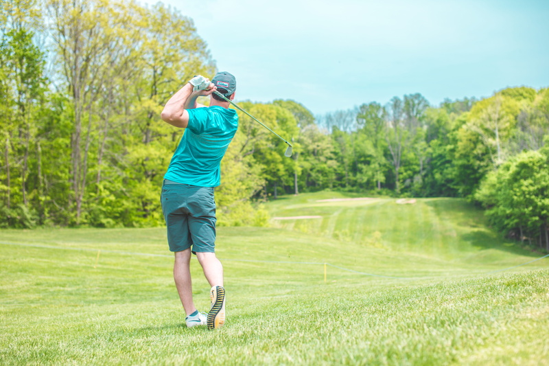 motion, standing, full length, blue, filer, cap, sports, day, activity, golfing, golf, taking a shot - sport, shorts, golf club, leisure activities, leisure activity