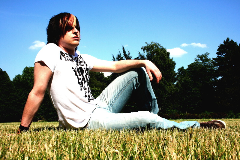 rocker, casual, tree, trees, black hair, blue, lifestyles, one person, cloud, young women, thoughtful, bracelet, clouds, rock, colorful hair, young man