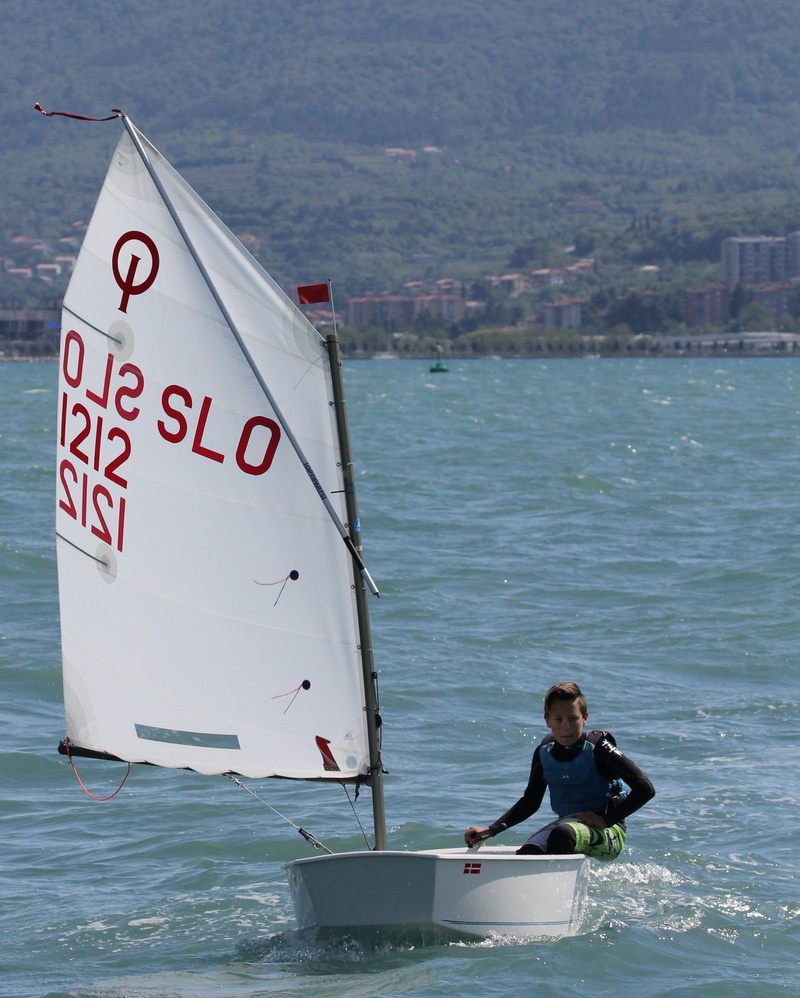 ioda, sailing, sea, optimist, sailor, one person, water, wind, real people, sail, young, casual clothing, communication, men, outdoors, competition, mode of transportation