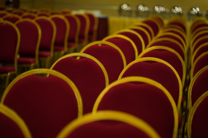 plastic, event, food and drink, arts culture and entertainment, red, indoors, close-up, meeting, seat, side by side, exhibition, entrance hall, domestic room