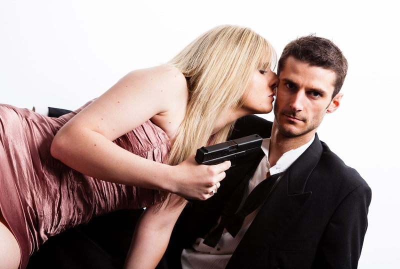 hair, adult, happy, beside, caucasian, pink, two people, crime, smiling, people, beauty, heterosexual couple, black tie, fun, handgun, gun, young couple