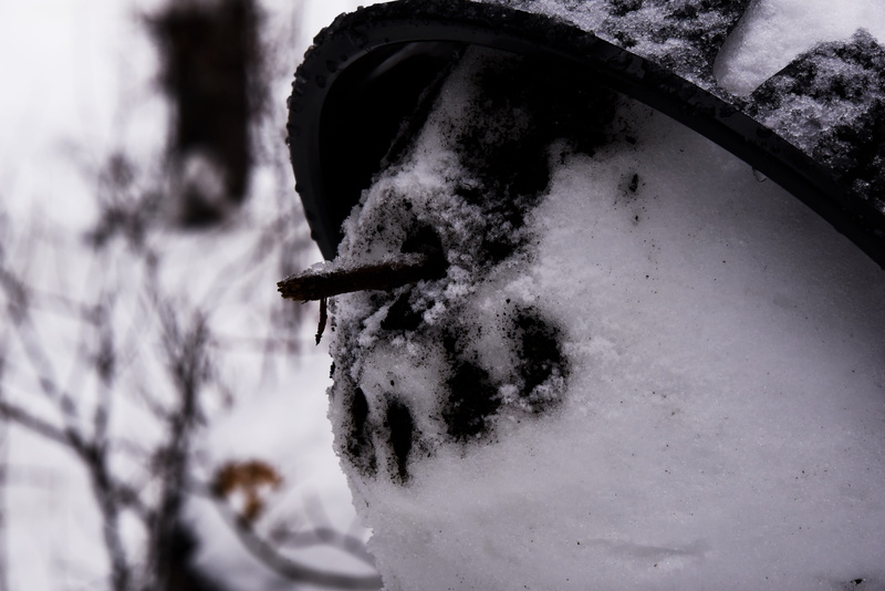 snowing, mode of transportation, winter, cold temperature, covering, blizzard, stick, face, snow, no people, figure, close-up, wheel, white color, snowman