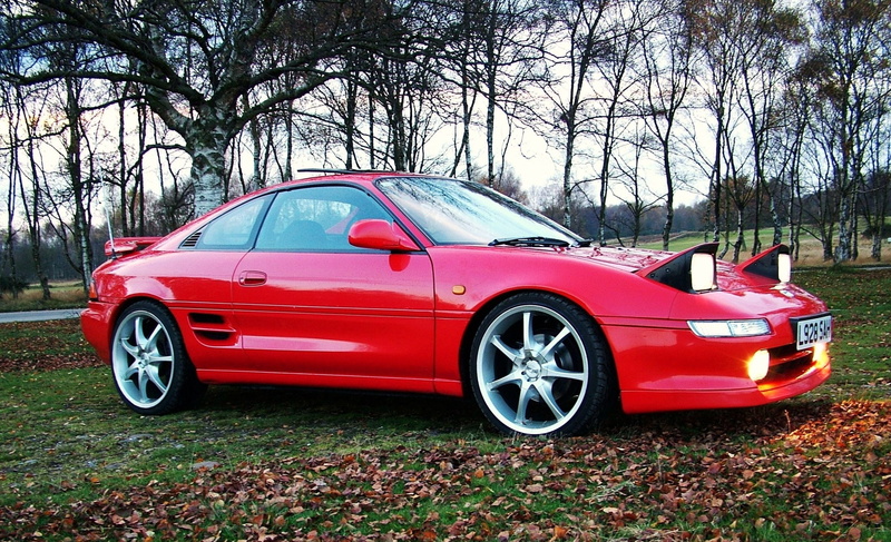 mr2, outdoors, automotive, handling, auto, japanese, retro styled, cogwheel, red, motor vehicle, day, shiny, component, industry, road, main, motion, no people