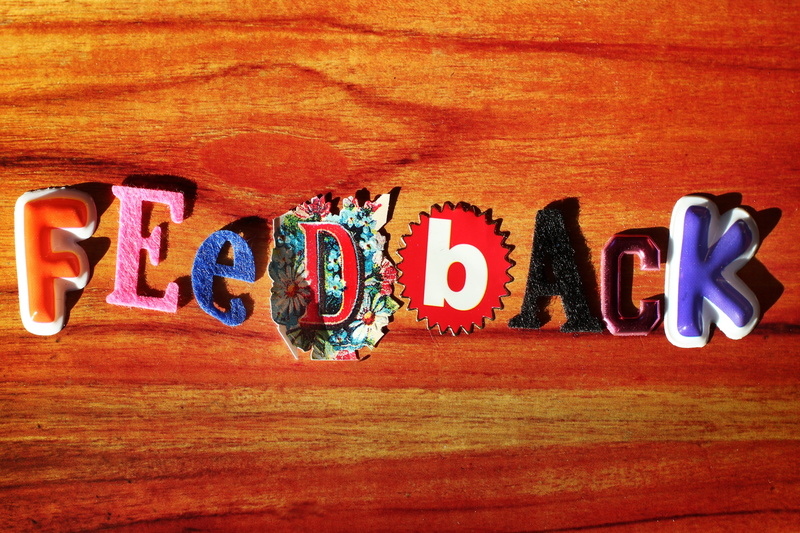 text, directly above, 5K, message, indoors, multi colored, tabletop, feedback, wood - material, single word, communication, handicraft, toy, creativity