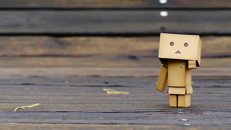 cardboard, representation, box, anime, bench, pvc figure, male likeness, robot, brown, small, copy space, wooden, yellow, toys, anthropomorphic, no people
