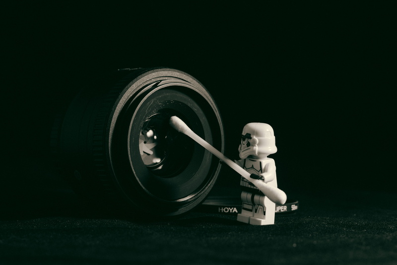 black background, camera, lego, holding, len, black color, star war, technology, indoors, q-tip, selective focus, photography themes, swab, pointed, studio shot