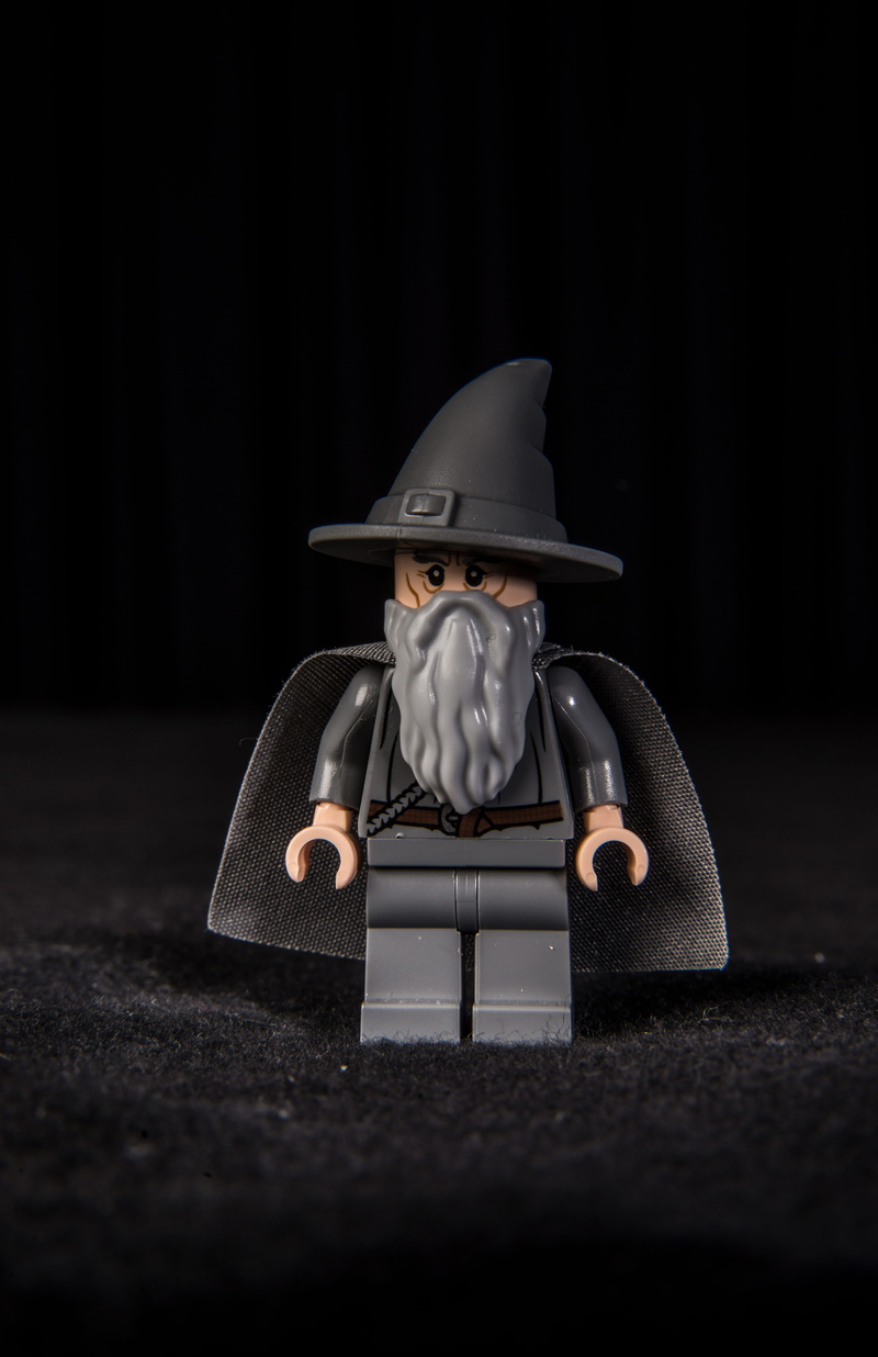 still life, black color, minifig, gray, black background, no people, close-up, art and craft, black, single object, creativity, copy space, humor, studio shot