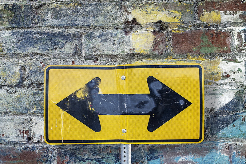 guidance, no people, texture, brick wall, symbol, textured, yellow, built structure, sign, spray paint, black color, communication, road, day, wall, road Sign