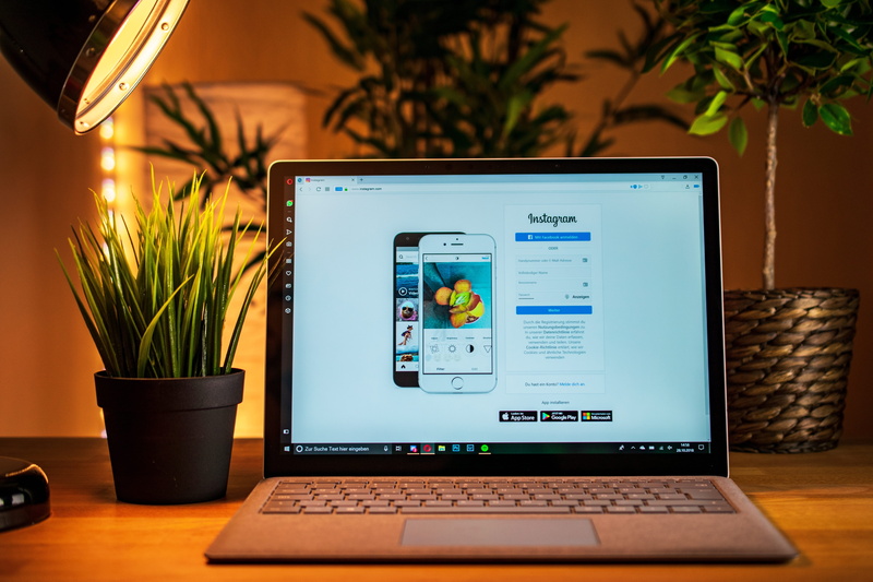 desk, computer monitor, instagram icon, portable information device, internet, office, macbook, potted plant, indoors, instagram, computer equipment, computer