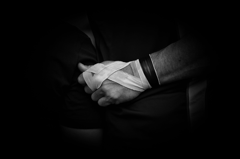 bandage, men, midsection, human hand, human body part, rugby sport, indoors, rugby union, belief, standing, hands, dark, black background, adult, close-up