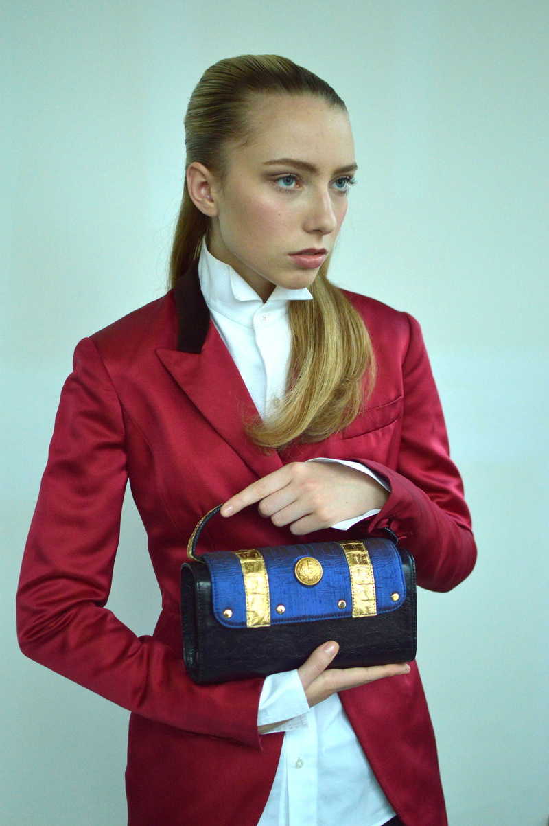 teenager, clothing, wear, young women, hands, wearing, pretty, one person, formal coat, contemplation, blue eyes, attractive, holding, front view, blue background