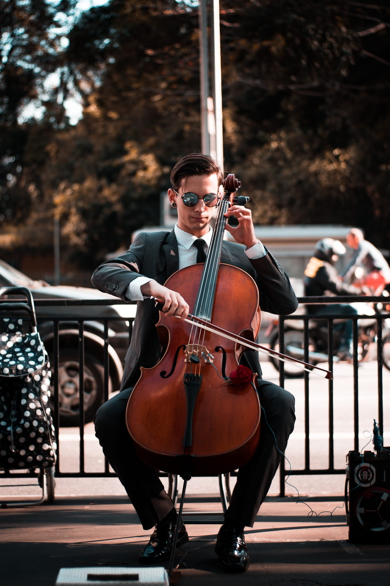 street performer, artist, arts culture and entertainment, performance, performer, musical instrument, concert, young adult, instrument, formal coat, performing
