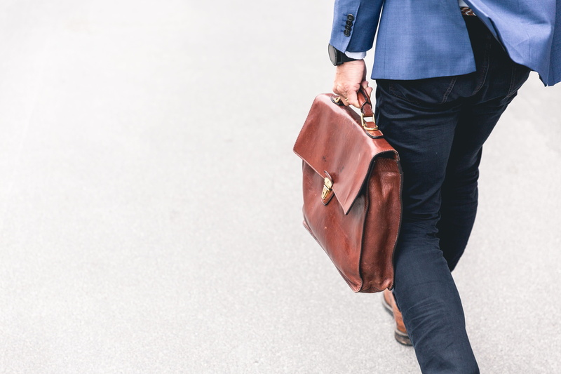pants, adult, person, bag, man, professional, leisure activity, one person, meeting, blue, finance, fashion, casual clothing, suit, standing, city, men