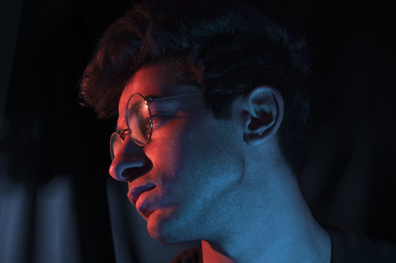 wearing, caucasian, serious, neon light, photo, man, profile view, looking, human Face, portrait, contemplation, black, men, indoors, 5K, adult, light